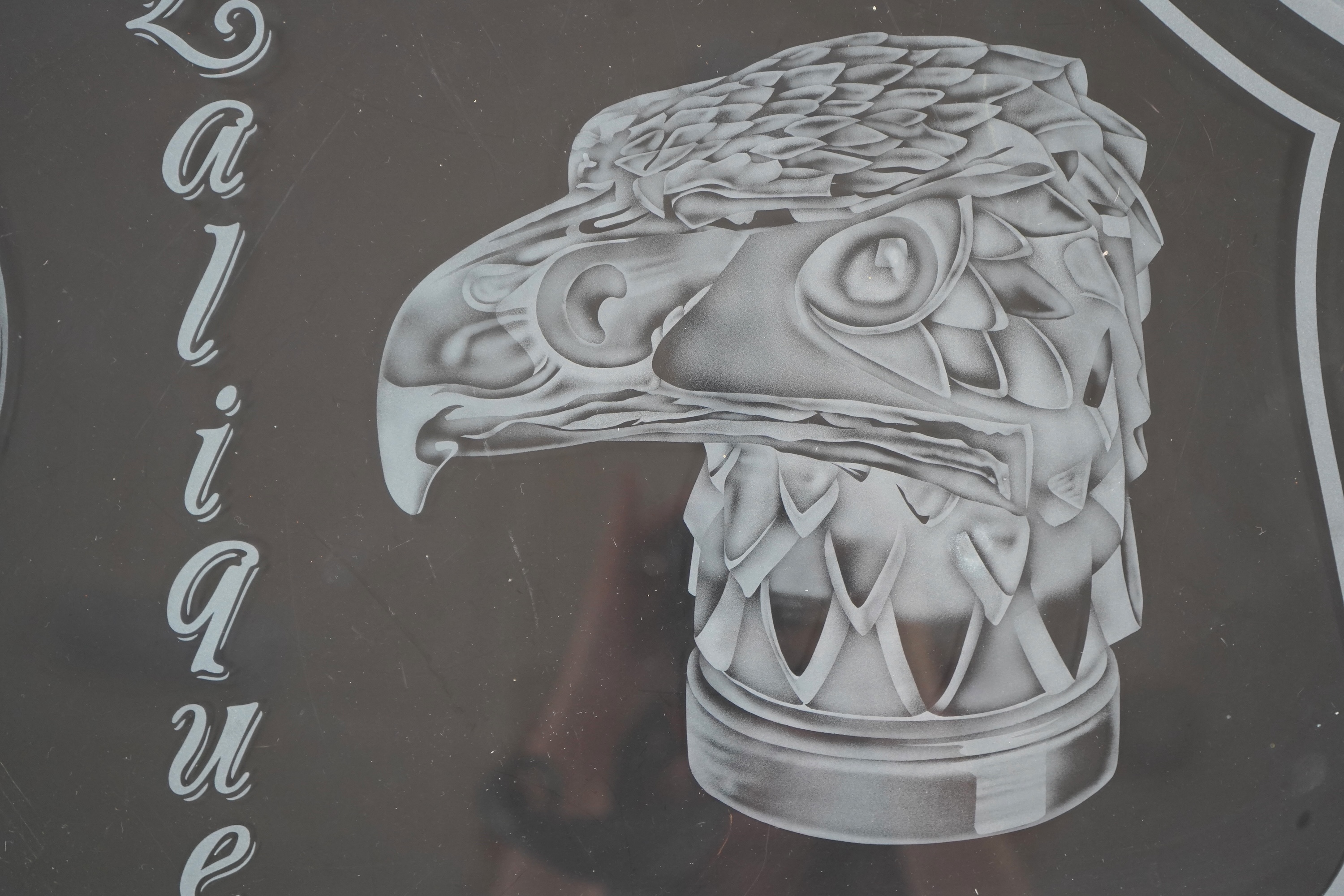 A rare boutique advertising hanging glass sign for Lalique